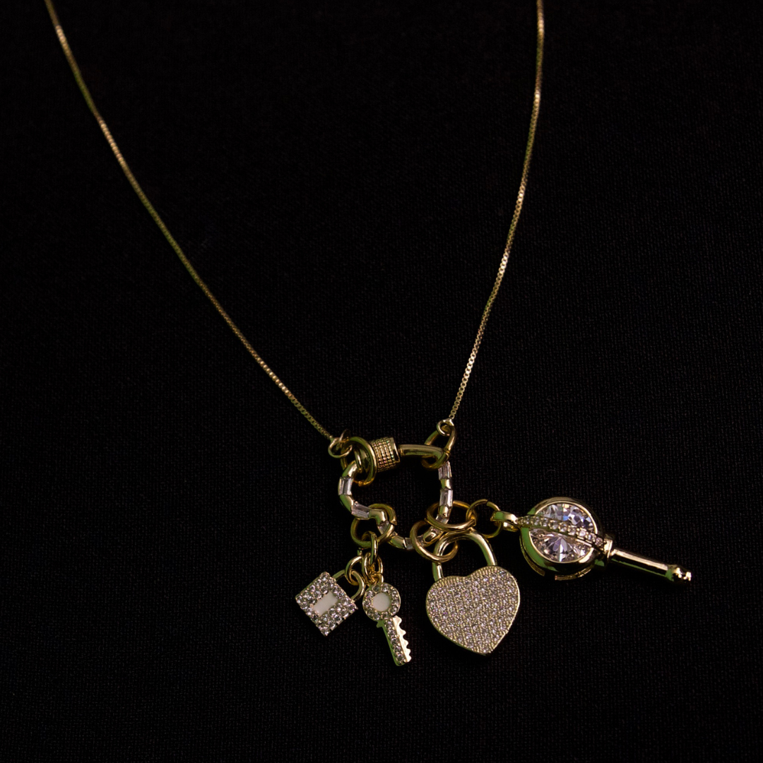 Love’s Key gold charms and gold cable chain necklace