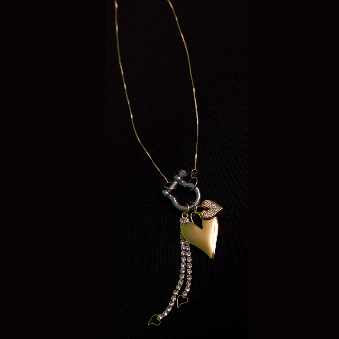 Radiant heart gold and silver charms and gold cable chain necklace